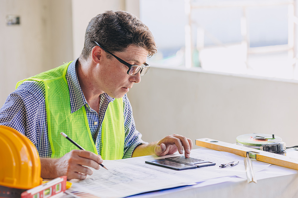 quantity surveyor reviewing a insurance valuation